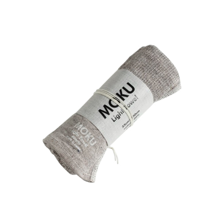 Moku Towel by Kontex is your go to towel for any active or travel situation. 100% Cotton, organic dyes and no palm oil. Highly absorbent, lightweight and quick drying, it wipes sweat away quickly and folds away small so that you can stash it in your bag. Grey, 33cm x 100cm